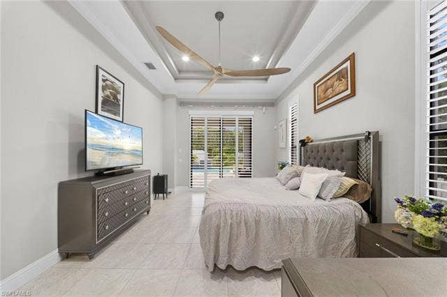 9796 Strike Ln, Bonita Springs, FL 34135 Recessed lighting, tray ceiling, tile flooring, and plantation shutters