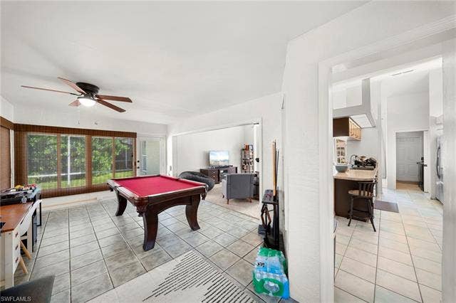 3730 21st Pl, Cape Coral, FL 33914 Tiled flooring, ceiling fan, and large windows with blinds