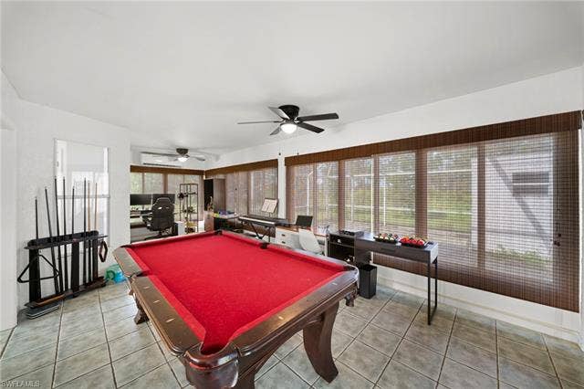 3730 21st Pl, Cape Coral, FL 33914 Tiled flooring, multiple ceiling fans, and extensive window treatments