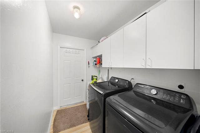 3730 21st Pl, Cape Coral, FL 33914 White cabinetry providing ample storage, overhead ceiling-mounted lighting, and wood-finish flooring