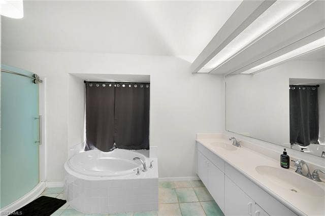 3730 21st Pl, Cape Coral, FL 33914 Dual vanity with undermount sinks, spacious mirror, and integrated lighting