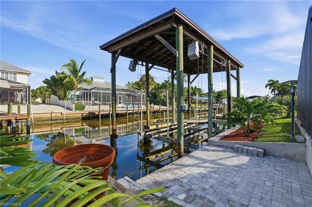 323 Washington Ct, Fort Myers Beach, FL 33931 COVERED BOATHOUSE AND CANAL VIEW RIGHT IN YOUR BACKYARD