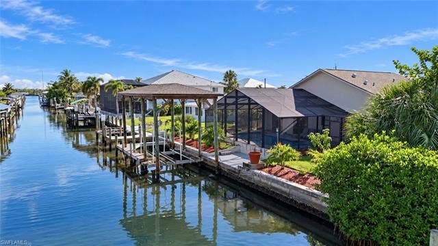323 Washington Ct, Fort Myers Beach, FL 33931 COVERED BOATHOUSE AND CANAL VIEWS RIGHT IN YOUR BACKYARD.