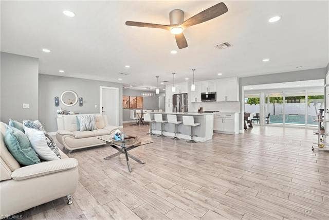 310 Madison Ct, Fort Myers Beach, FL 33931 Open layout with updated kitchen and living area