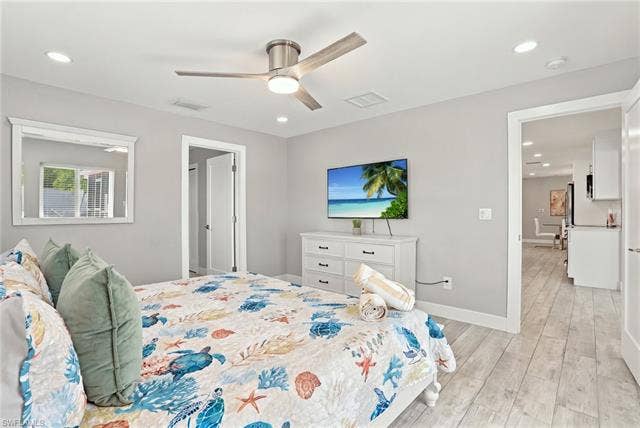 310 Madison Ct, Fort Myers Beach, FL 33931 Primary bedroom with TV
