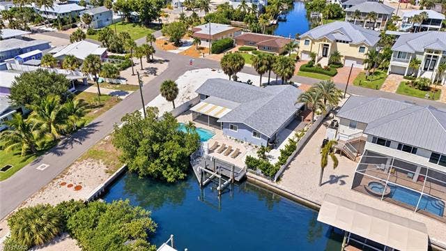 310 Madison Ct, Fort Myers Beach, FL 33931 Aerial view of home with gulf access canal