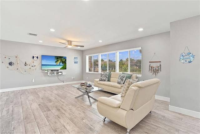 310 Madison Ct, Fort Myers Beach, FL 33931 Spacious living area with coastal decor