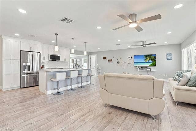 310 Madison Ct, Fort Myers Beach, FL 33931 Open layout with kitchen and living area
