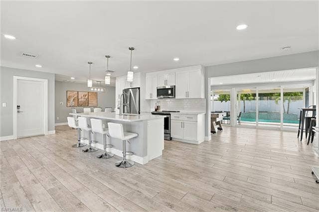 310 Madison Ct, Fort Myers Beach, FL 33931 Open layout with kitchen and living area