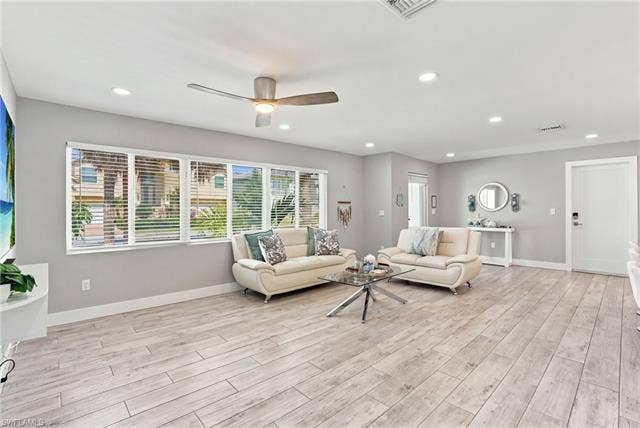 310 Madison Ct, Fort Myers Beach, FL 33931 Spacious living area with coastal decor