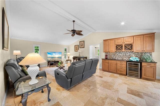 2171 Kings Lake Blvd, Naples, FL 34112 Vaulted ceilings with exposed beams, ceiling fan, and recessed lighting