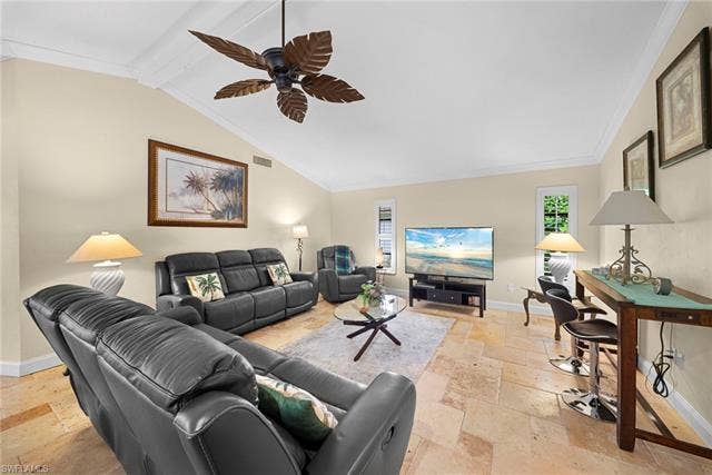 2171 Kings Lake Blvd, Naples, FL 34112 Vaulted ceiling, crown molding, ceiling fan with leaf-shaped blades, recessed windows, tile flooring