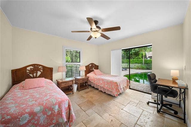 2171 Kings Lake Blvd, Naples, FL 34112 Travertine flooring, ceiling fan with integrated lighting, window with louvered blinds, and a sliding glass door leading to a patio with a pool