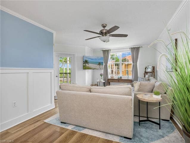 8659 River Homes Ln, #1202, Bonita Springs, FL 34135 Light and bright living area with access to the rear balcony