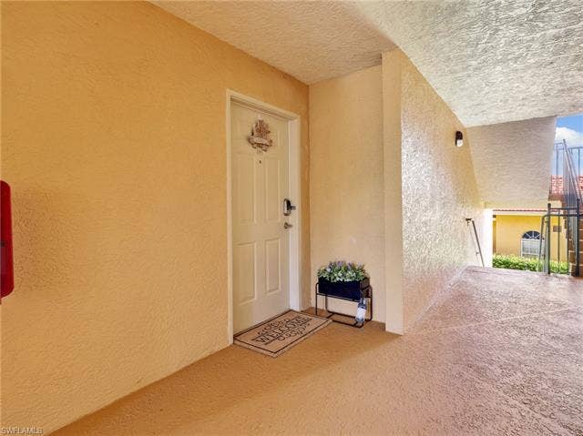 8659 River Homes Ln, #1202, Bonita Springs, FL 34135 2nd floor end unit front door