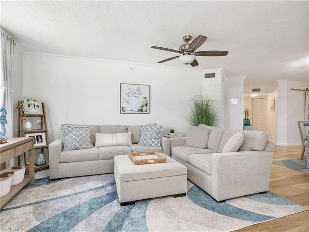 8659 River Homes Ln, #1202, Bonita Springs, FL 34135 Cozy living room perfect for relaxing and entertaining