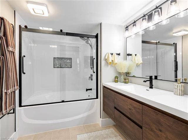 8659 River Homes Ln, #1202, Bonita Springs, FL 34135 A spa-inspired primary bath designed for relaxation, featuring a sleek glass-enclosed shower, modern finishes, and a calm, resort-like atmosphere