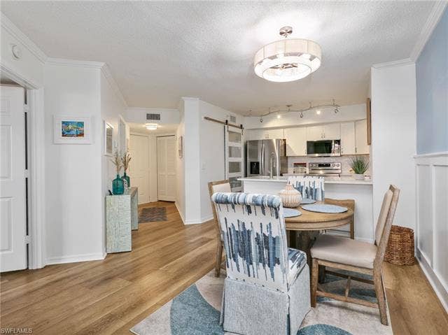 8659 River Homes Ln, #1202, Bonita Springs, FL 34135 Open floor plan kitchen looks into the living area