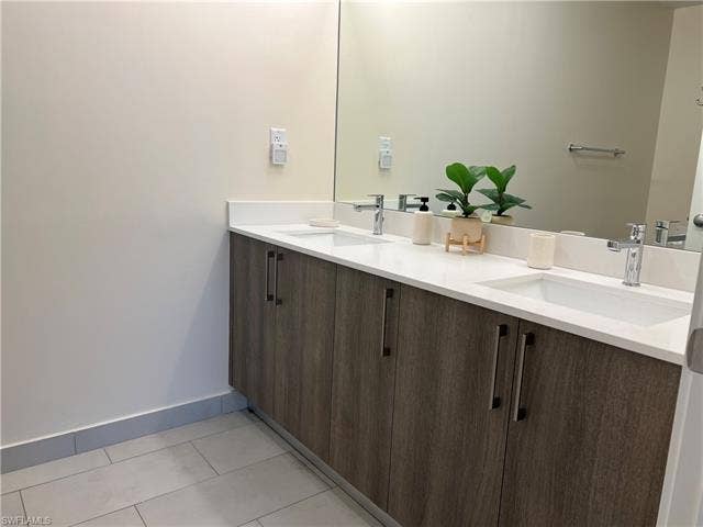 26600 Rosewood Pointe Dr, #B-107, Bonita Springs, FL 34135 Bathroom featuring tile patterned flooring and vanity