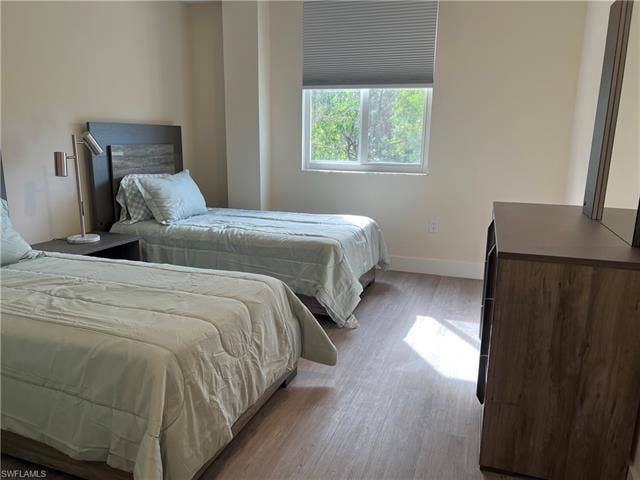 26600 Rosewood Pointe Dr, #B-107, Bonita Springs, FL 34135 Bedroom featuring light hardwood / wood-style flooring