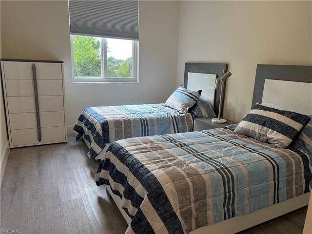 26600 Rosewood Pointe Dr, #B-107, Bonita Springs, FL 34135 Bedroom with wood-type flooring
