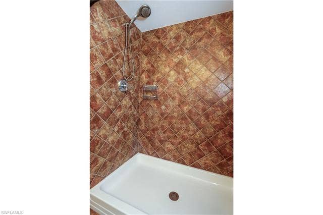 25484 Cockleshell Dr, #901, Bonita Springs, FL 34135 Bathroom featuring tiled shower