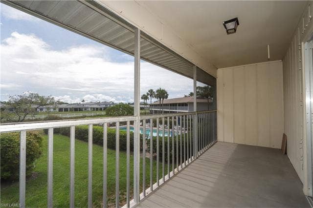 25484 Cockleshell Dr, #901, Bonita Springs, FL 34135 Balcony with view of pool area