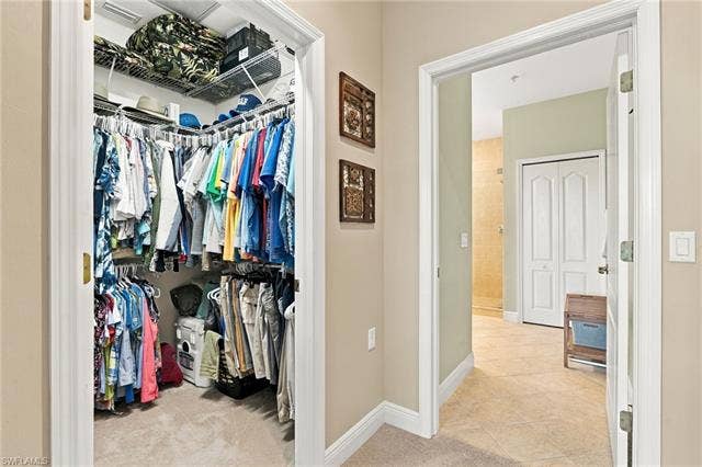11041 Gulf Reflections Dr, #403, Fort Myers, FL 33908 Walk-in closet with wire shelving system and carpet flooring