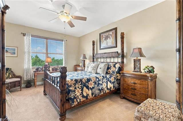 11041 Gulf Reflections Dr, #403, Fort Myers, FL 33908 Expansive window with privacy blinds, ceiling fan with integrated lighting, and neutral wall color