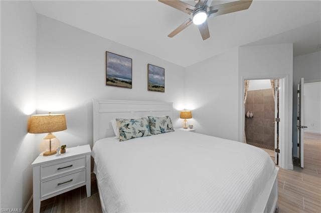 44810 Marina Ln, Punta Gorda, FL 33982 Recessed lighting, ceiling fan with light fixture, wood-finish flooring, and a tiled shower enclosure