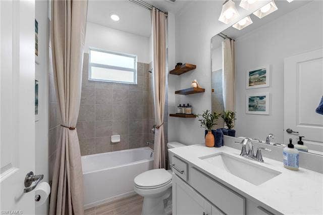 44810 Marina Ln, Punta Gorda, FL 33982 White vanity with an integrated rectangular sink and chrome faucet