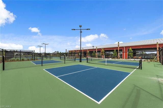 44810 Marina Ln, Punta Gorda, FL 33982 Multiple outdoor courts with fencing, permanent netting, and overhead lighting