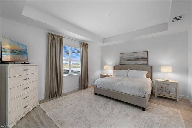44810 Marina Ln, Punta Gorda, FL 33982 Tray ceiling, recessed lighting, large window with blinds, tile flooring