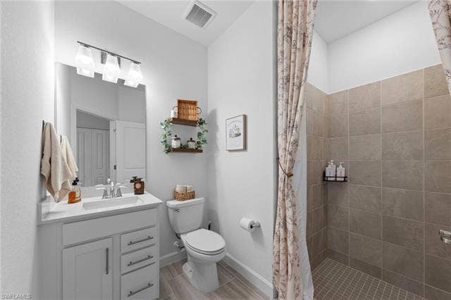 44810 Marina Ln, Punta Gorda, FL 33982 White vanity with an integrated sink and chrome faucet, rectangular mirror, and an overhead light fixture