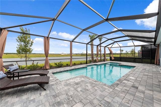 44810 Marina Ln, Punta Gorda, FL 33982 Screened patio with a rectangular swimming pool and integrated spa