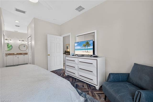 14543 Abaco Lakes Dr, #202, Fort Myers, FL 33908 Primary suite layout showing the spacious seating area and the convenient, direct access to the attached primary bathroom.