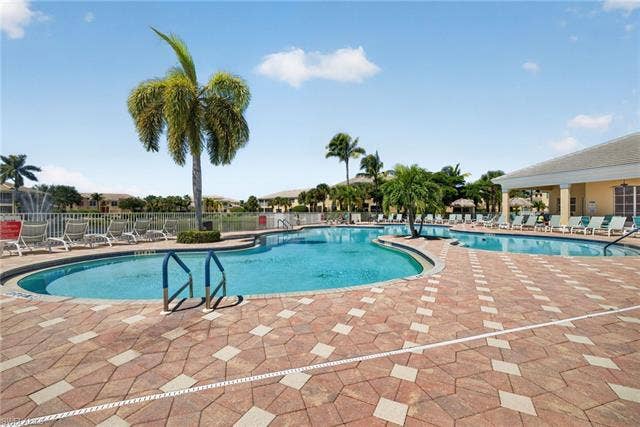 14543 Abaco Lakes Dr, #202, Fort Myers, FL 33908 Dive into luxury with this sprawling resort-style community pool