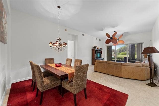 3142 Aviamar Cir, #2104, Naples, FL 34114 Open-concept living area with a formal dining space, tile flooring, and a ceiling fan