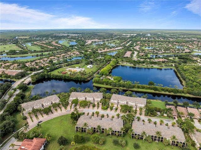 3142 Aviamar Cir, #2104, Naples, FL 34114 Expansive community featuring multiple bodies of water, extensive green spaces, and mature landscaping