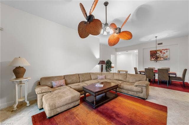 3142 Aviamar Cir, #2104, Naples, FL 34114 Recessed lighting, paddle blade ceiling fans, a chandelier over the dining area, and neutral wall tones