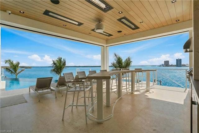 280 Estrellita Dr, Fort Myers Beach, FL 33931 View of patio / terrace featuring a water view - Virtually Edited Image
