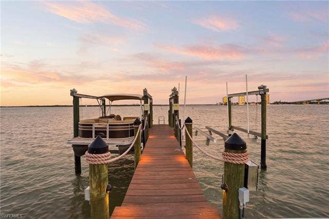 280 Estrellita Dr, Fort Myers Beach, FL 33931 Dock area featuring boat lift and a water view - Virtually Edited Image
