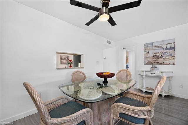 6220 Augusta Dr, #117, Fort Myers, FL 33907 Recessed pass-through window with integrated shelving, ceiling fan with integrated lighting, and tile flooring