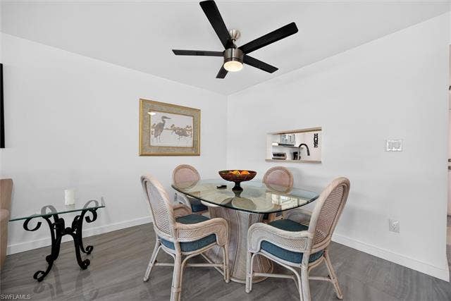6220 Augusta Dr, #117, Fort Myers, FL 33907 Recessed pass-through window, overhead ceiling fan with lighting, and tile flooring