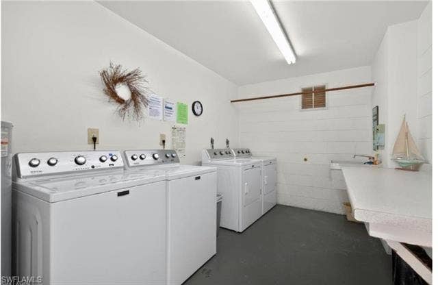 6220 Augusta Dr, #117, Fort Myers, FL 33907 Dedicated Laundry room featuring white appliances and a utility sink