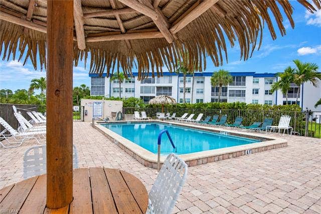 6220 Augusta Dr, #117, Fort Myers, FL 33907 Outdoor swimming pool with a paved patio surround