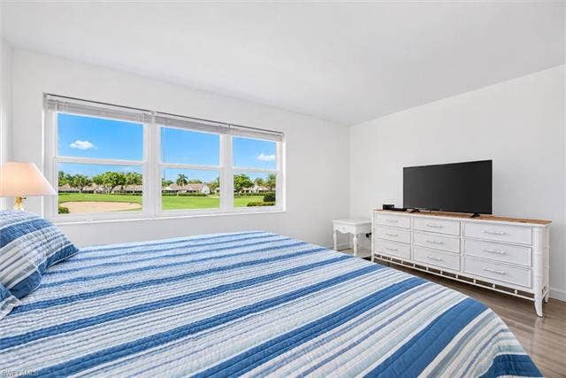 6220 Augusta Dr, #117, Fort Myers, FL 33907 Bright interior with white walls, multi-pane windows, and tile flooring
