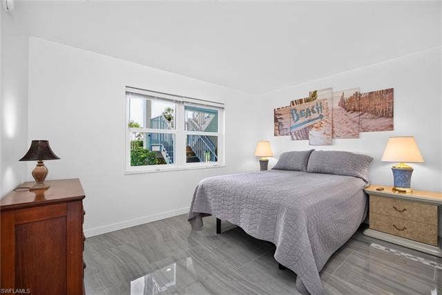 6220 Augusta Dr, #117, Fort Myers, FL 33907 Window with exterior architectural details, white walls, and tile flooring