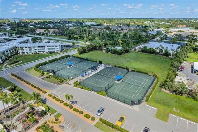 6220 Augusta Dr, #117, Fort Myers, FL 33907 Multiple tennis courts featuring green playing surfaces and perimeter fencing