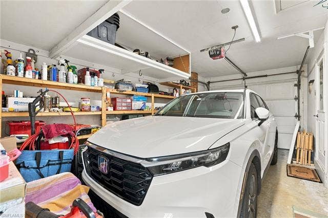 2816 18th Ave, Cape Coral, FL 33904 Garage with overhead storage and shelving
